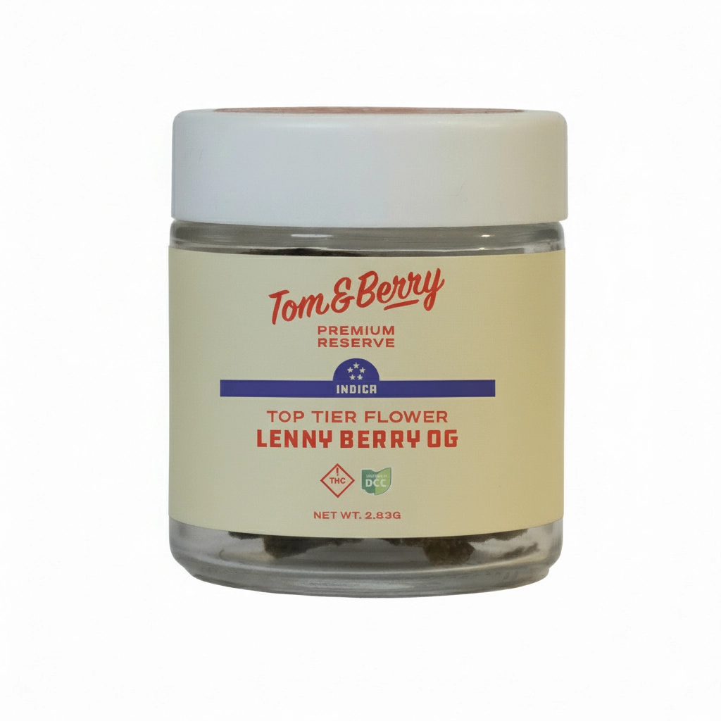 Lenny Berry OG flower in a Tom & Berry Premium Reserve glass jar with a cream and red label